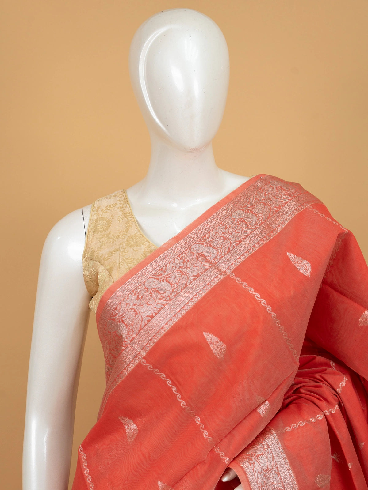 Coral orange silk cotton saree with silver zari buttis and ornate zari border