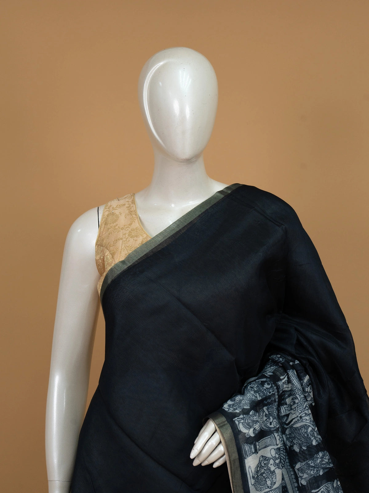 Black linen cotton saree with white Kalamkari-style peacock and floral printed pallu and a slim zari border