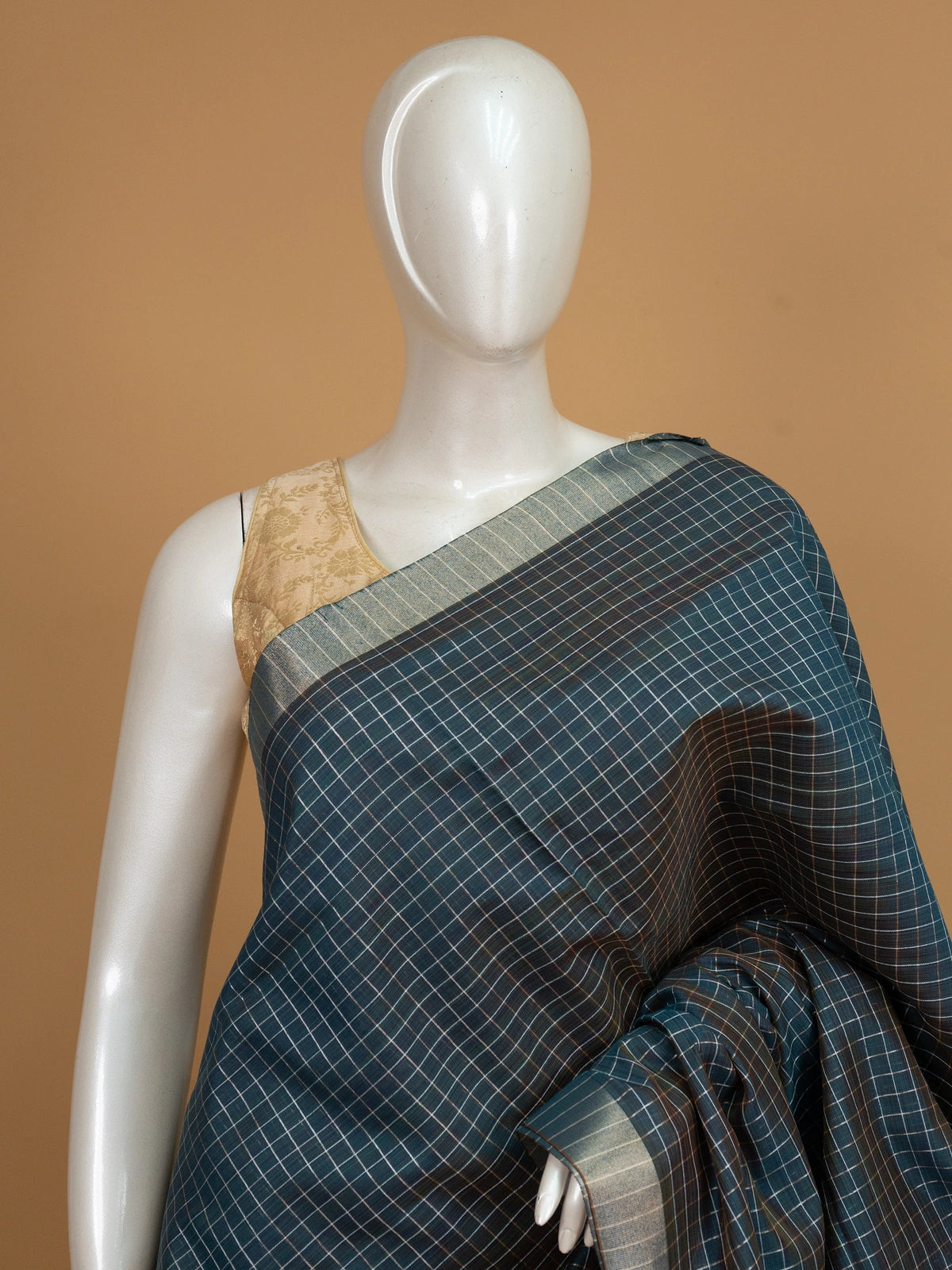 Teal linen cotton saree with white and gold checks, contrast zari border and striped turquoise pallu