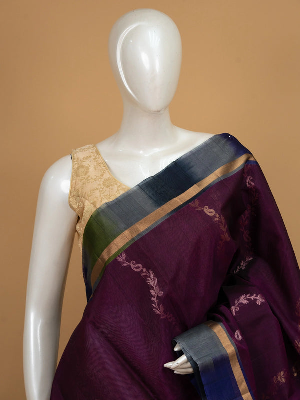Purple pure silk cotton saree with green contrast zari border and floral lotus pallu