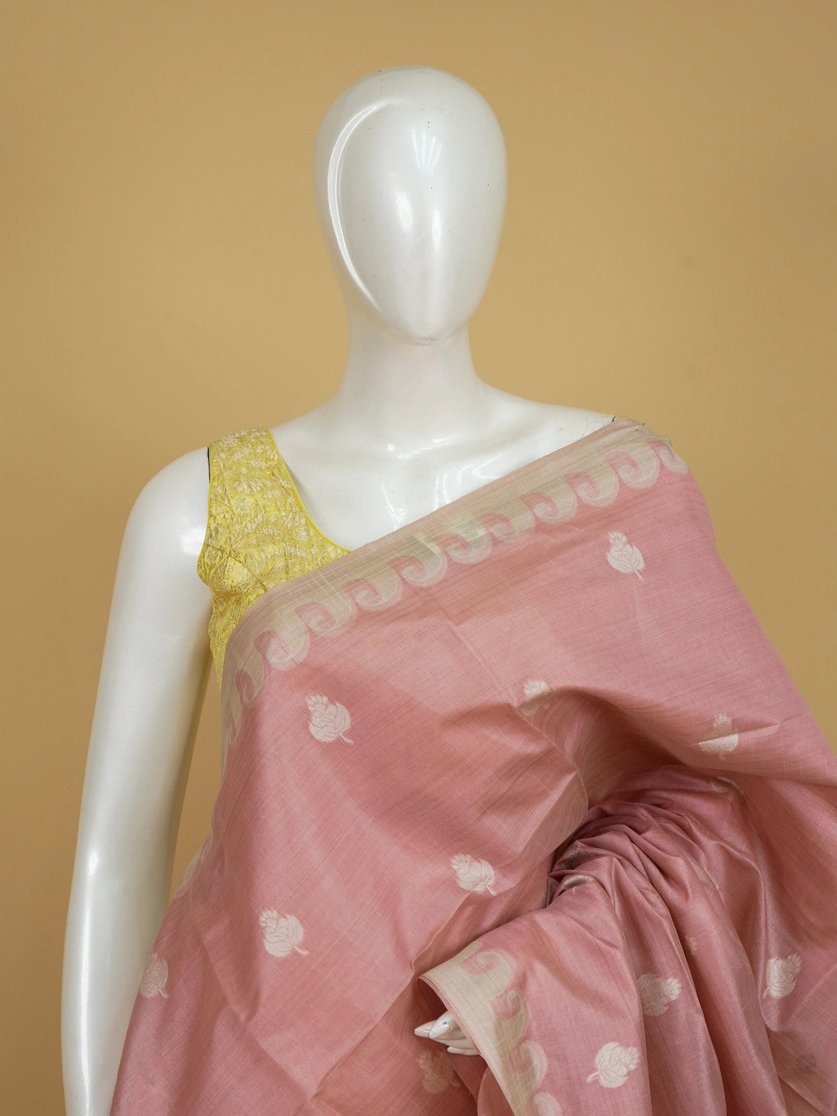 Dusty rose pink linen cotton saree with cream floral buttas, contrast scroll border and printed kalamkari pallu