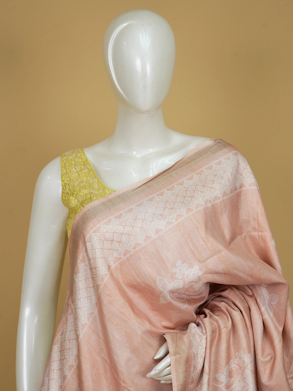 Peach Dola silk saree with white woven floral motifs and tonal zari border