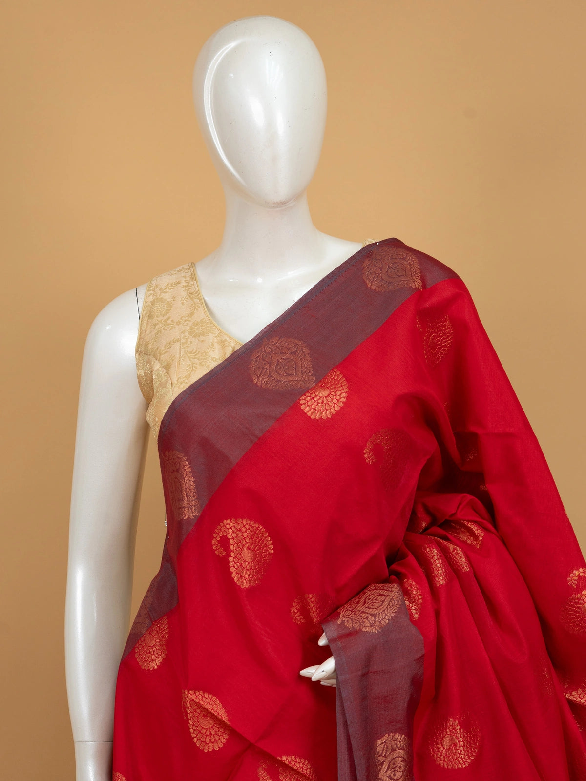Red silk cotton saree with gold zari paisley buttas and contrast grey zari border and pallu
