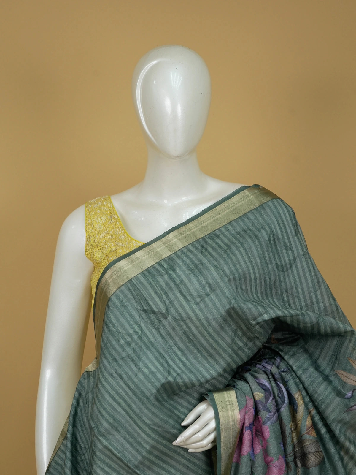 Sage green semi tussar saree with tropical floral print pallu and gold zari border