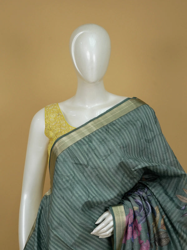 Sage green semi tussar saree with tropical floral print pallu and gold zari border
