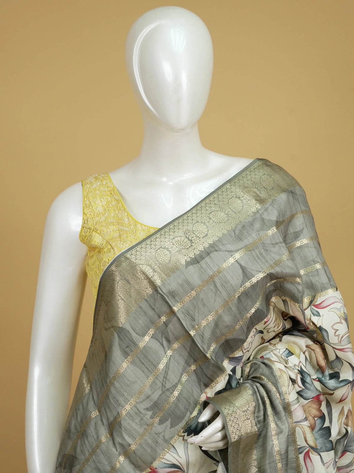 Cream semi tussar saree with multicolour floral print and grey gold zari border