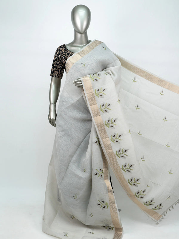 White linen cotton saree with gold zari border, embroidered leaf buttas and contrast black blouse