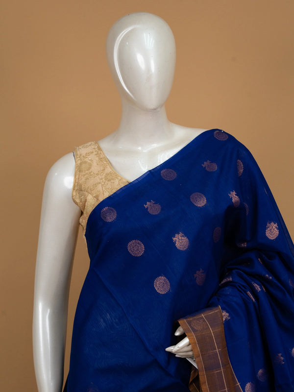Royal blue pure silk cotton saree with copper-gold zari peacock buttas and contrast border