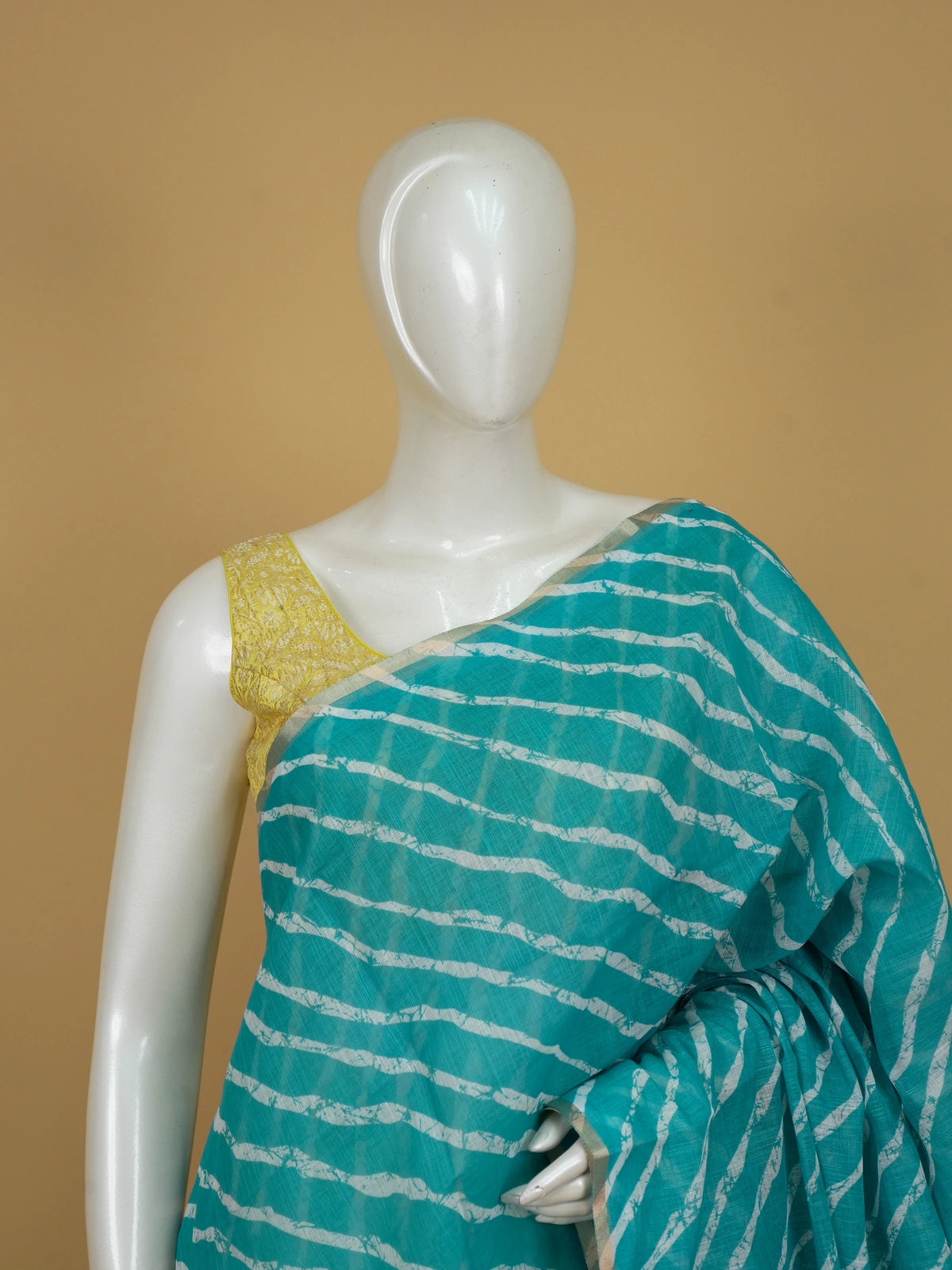Teal and white leheriya printed linen cotton saree with floral pallu and gold border