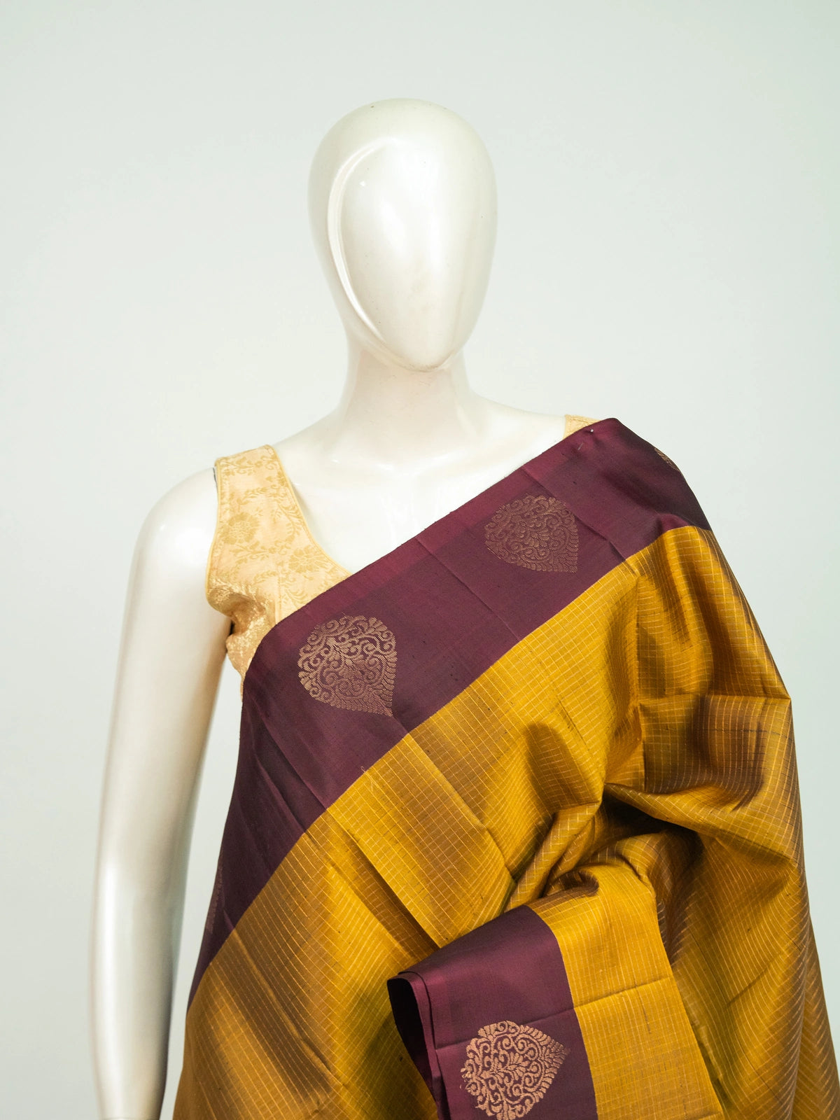 Mustard yellow pure soft silk saree with maroon contrast border and gold zari checks