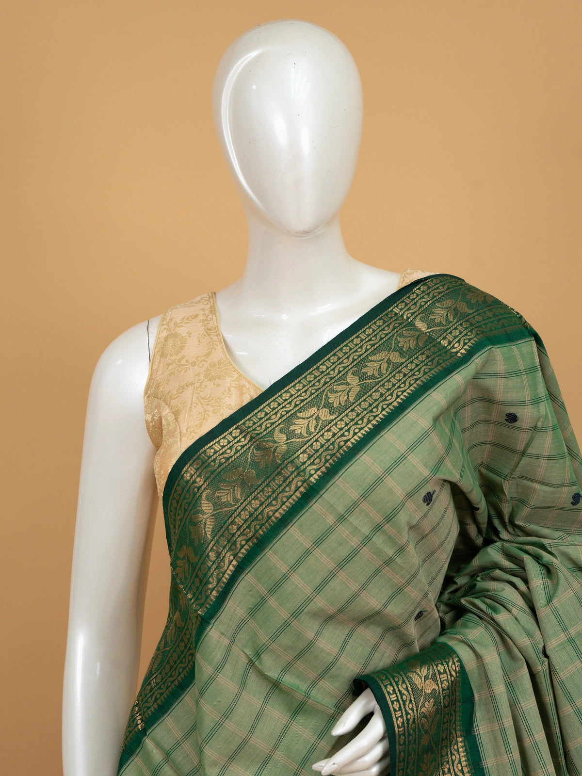 Green checked Chettinad cotton saree with navy buttas and contrast gold zari border