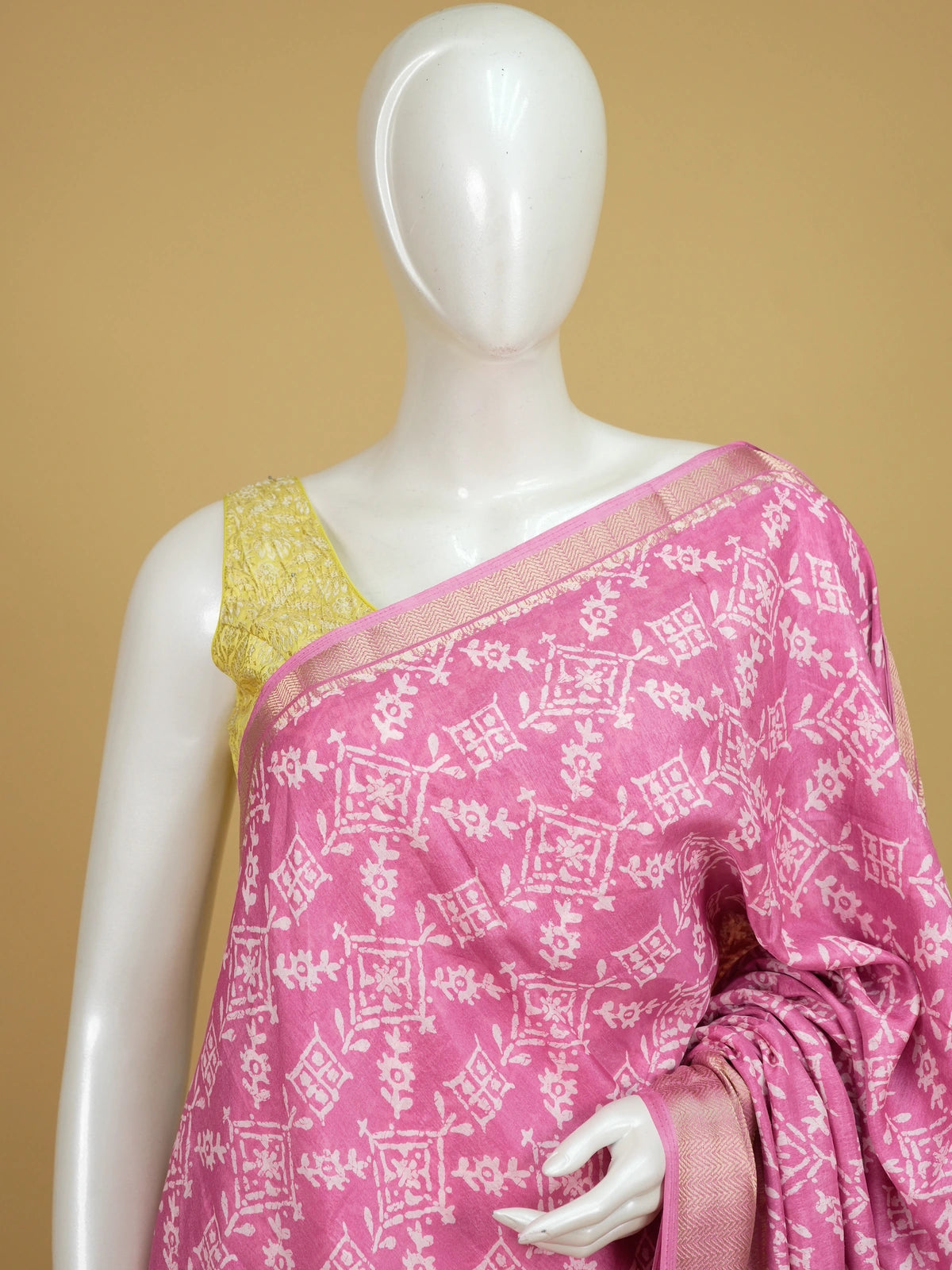 Pink and white batik print cotton designer saree with gold zari border