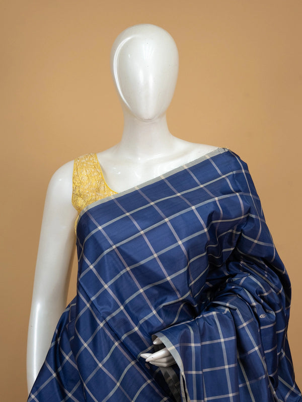 Royal blue and cream checked banana silk saree with woven butta motifs and a striped contrast pallu