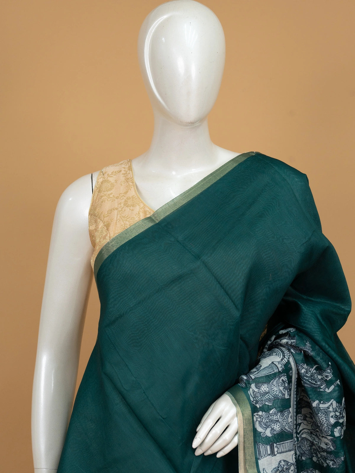 Teal green linen cotton saree with white kalamkari peacock and floral pallu and gold zari border
