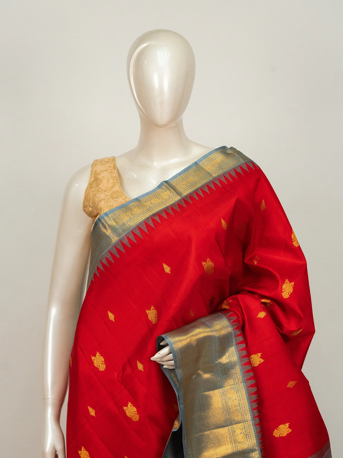 Red pure Kanchipuram silk saree with contrast grey gold zari temple border and woven buttas