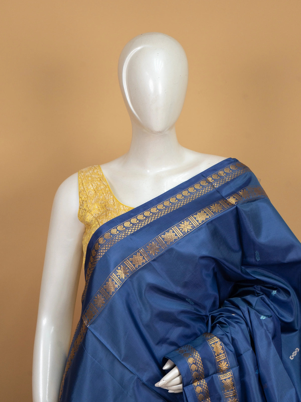 Navy blue banana silk saree with gold zari border and contrast grey pallu