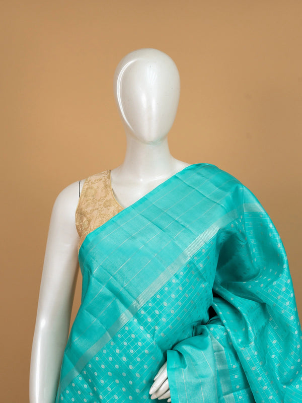 Turquoise blue pure Kanchipuram silk saree with silver zari checks, buti motifs and striped zari border