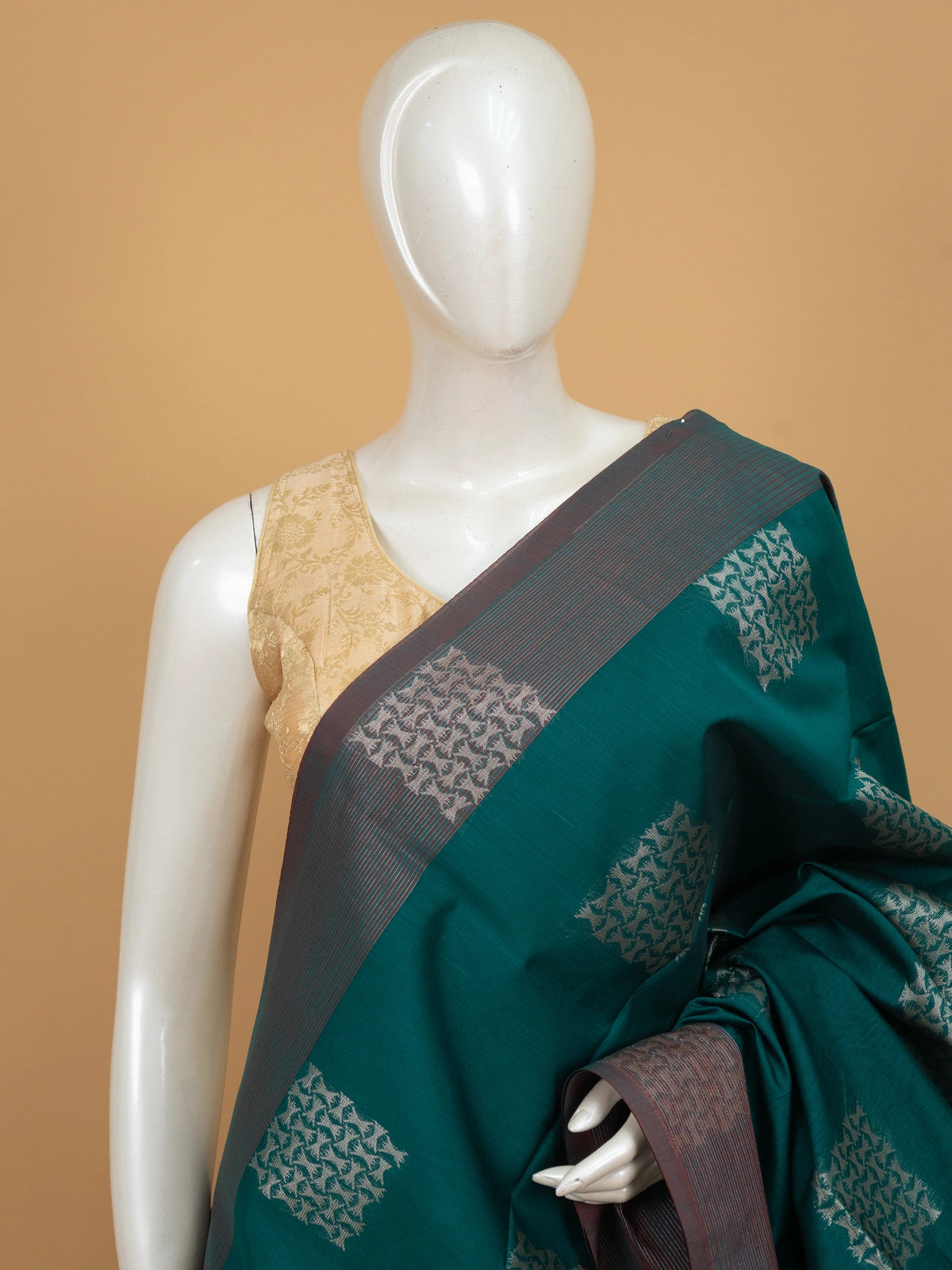Teal green silk cotton saree with silver zari butta and contrast maroon border