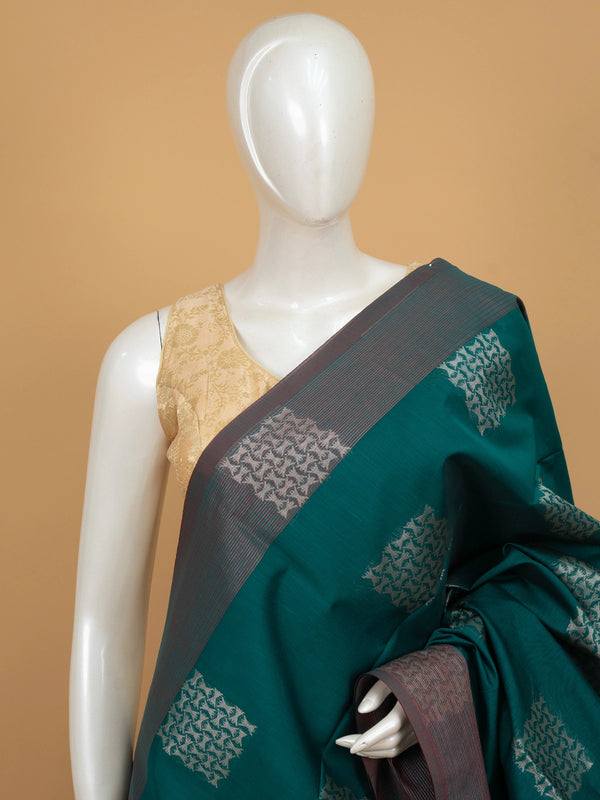 Teal green silk cotton saree with silver zari butta and contrast maroon border