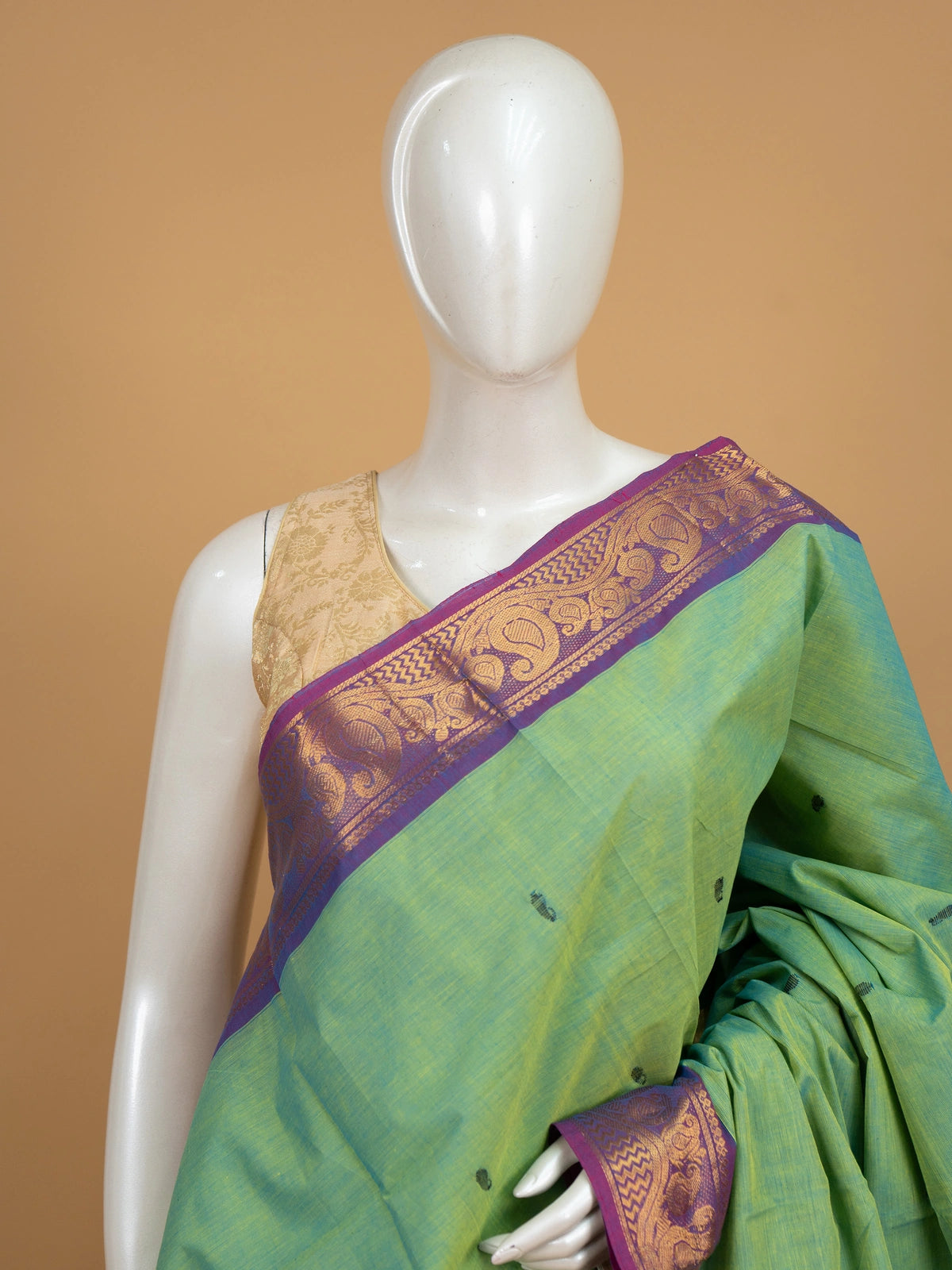 Green Chettinad cotton saree with contrast purple gold zari border and striped pallu