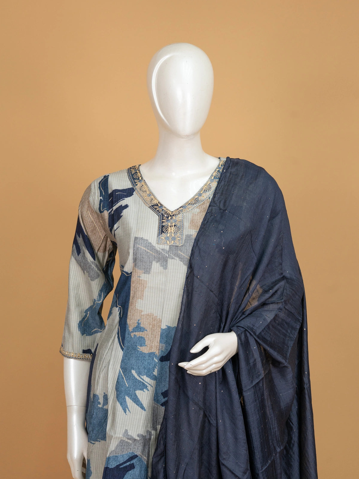 Cream and blue abstract print A-Line kurti set with zari embroidered neckline and navy dupatta
