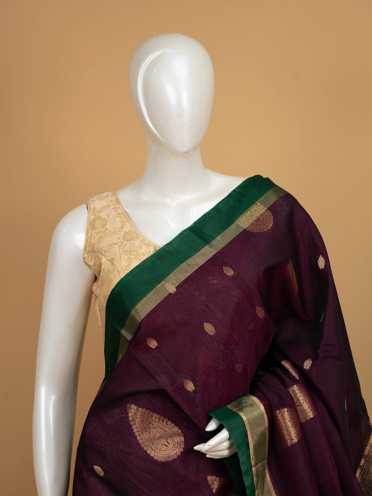Purple pure silk cotton saree with contrast green zari border and gold peacock motif pallu