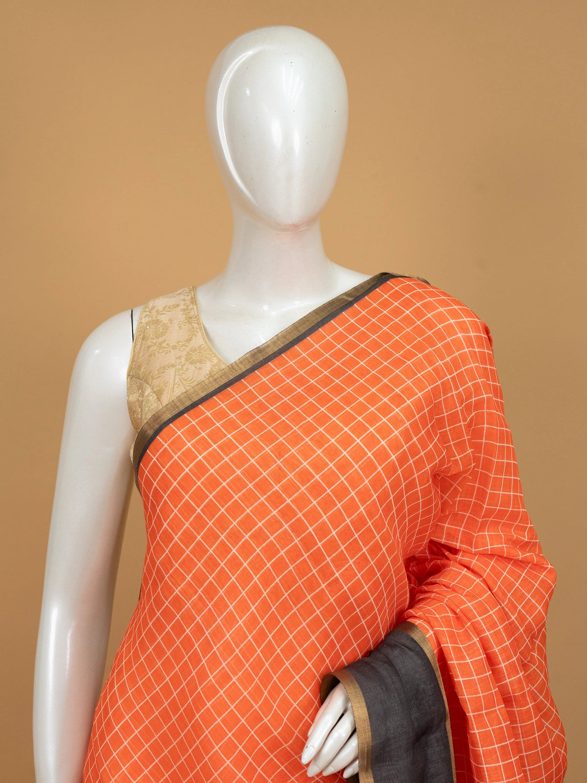 Orange linen cotton saree with white checks, contrast grey checked border and striped pallu