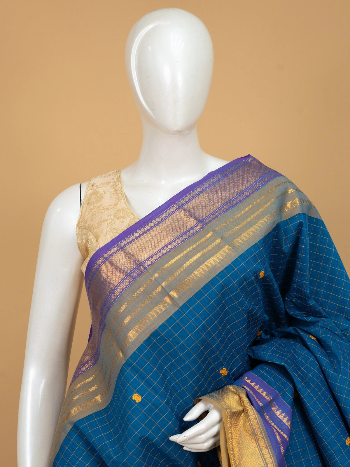 Peacock blue Chettinad cotton saree with gold checks, mustard butta motifs and contrast purple gold zari border