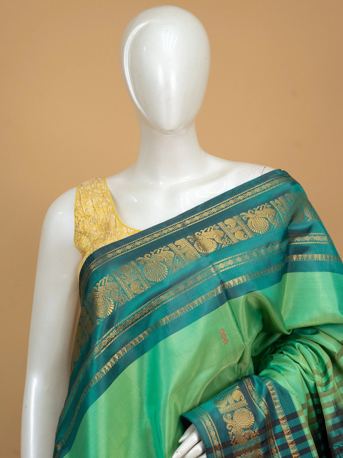 Green and black Banana Silk saree with gold zari peacock border and contrast pallu