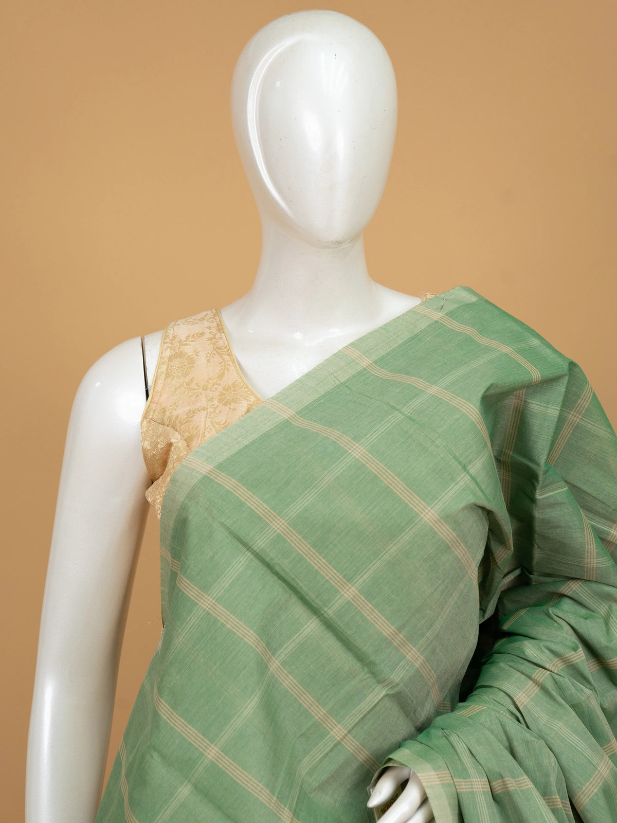 Sage green and beige checked silk cotton saree with striped pallu and contrast cream blouse