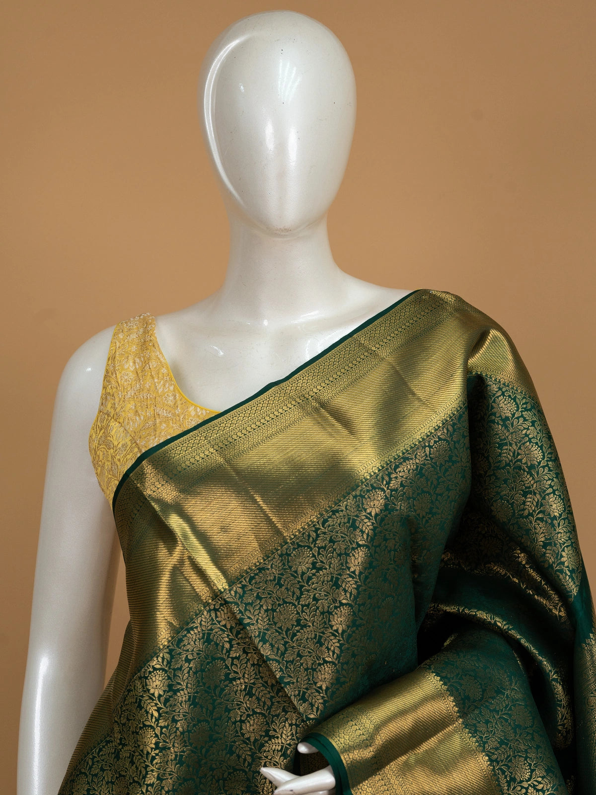 Deep green pure Kanchipuram silk saree with allover gold zari floral brocade and contrast gold zari border