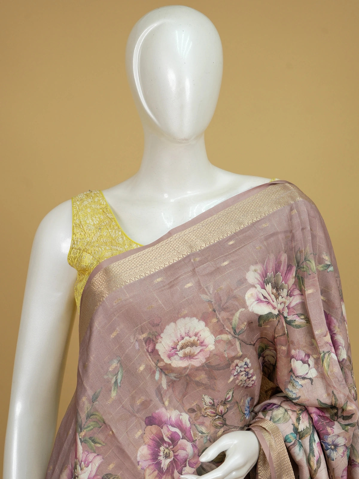 Dusty rose designer saree with multicolour floral print, gold zari checks and woven gold border