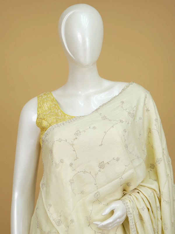Cream designer saree with silver sequin floral embroidery and scalloped border