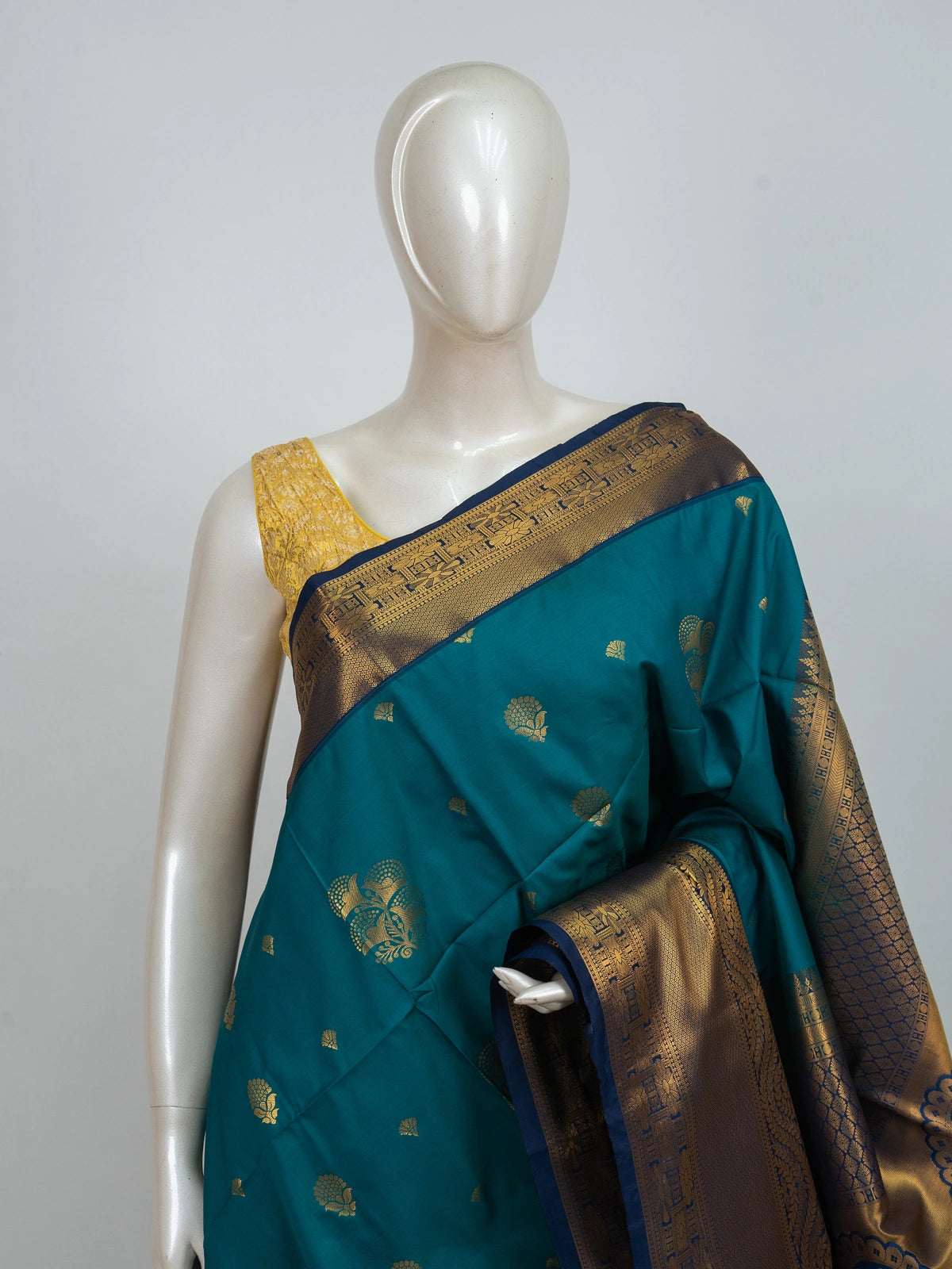 Peacock teal Kanchipuram Fancy Silk saree with contrast navy border and gold zari paisley pallu