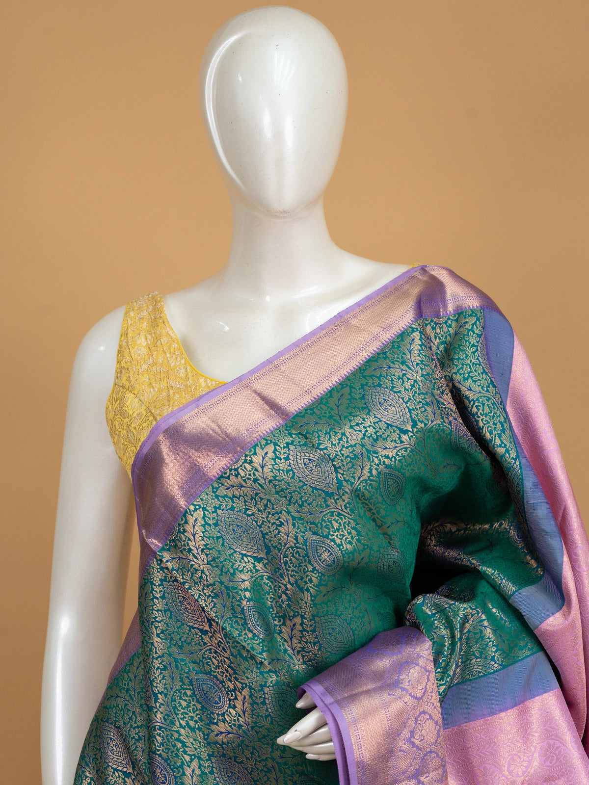 Teal green pure Kanchipuram silk saree with gold zari brocade and contrast lilac pink border and pallu