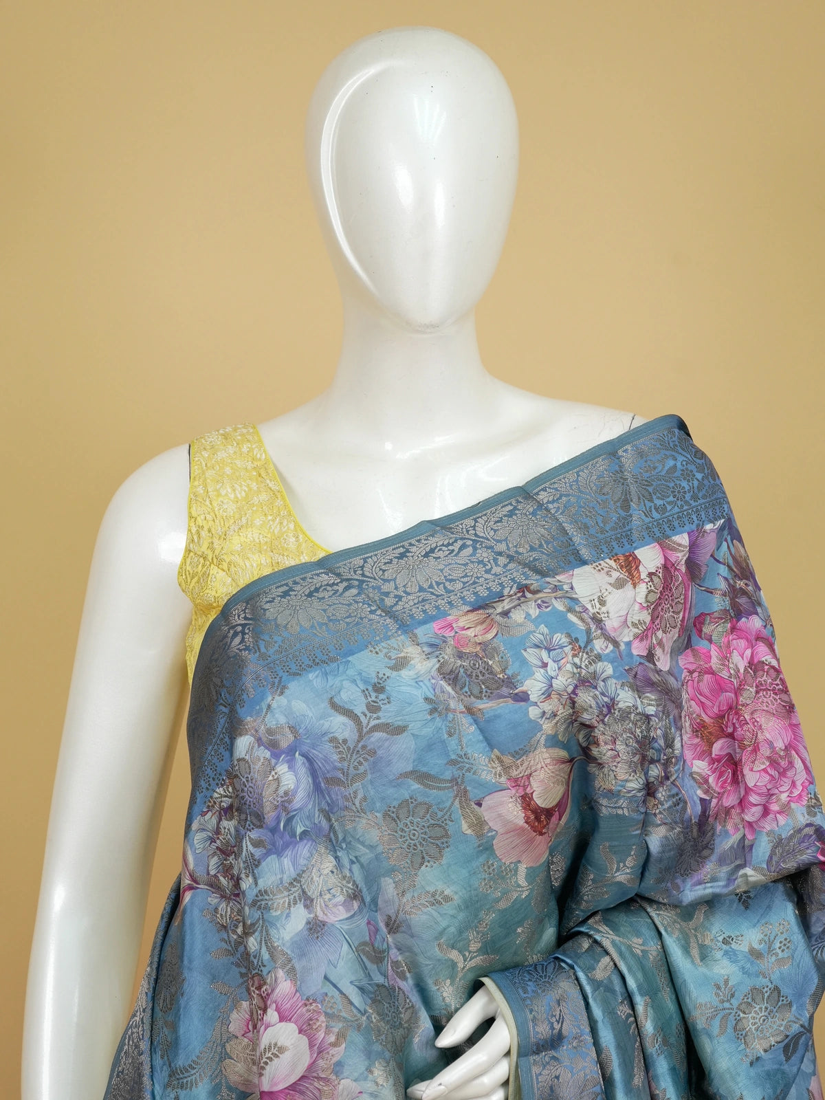 Teal blue semi tussar saree with pink floral print and contrast zari border