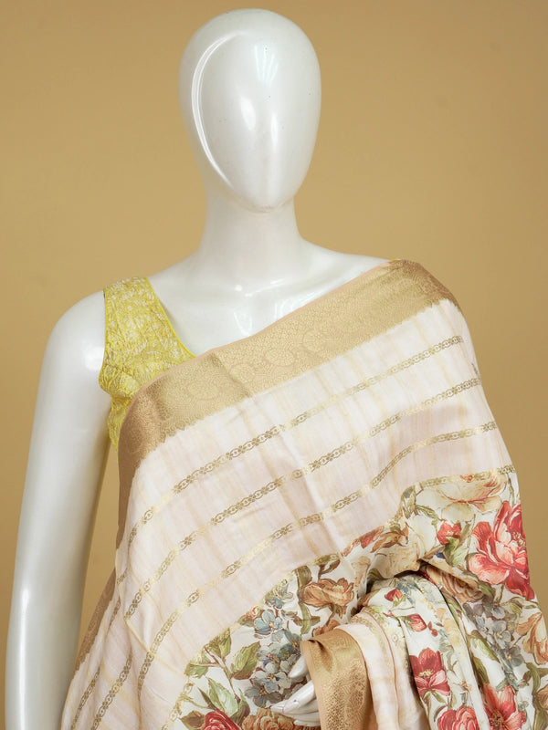 Cream floral print Dola silk saree with gold zari stripes and contrast woven border