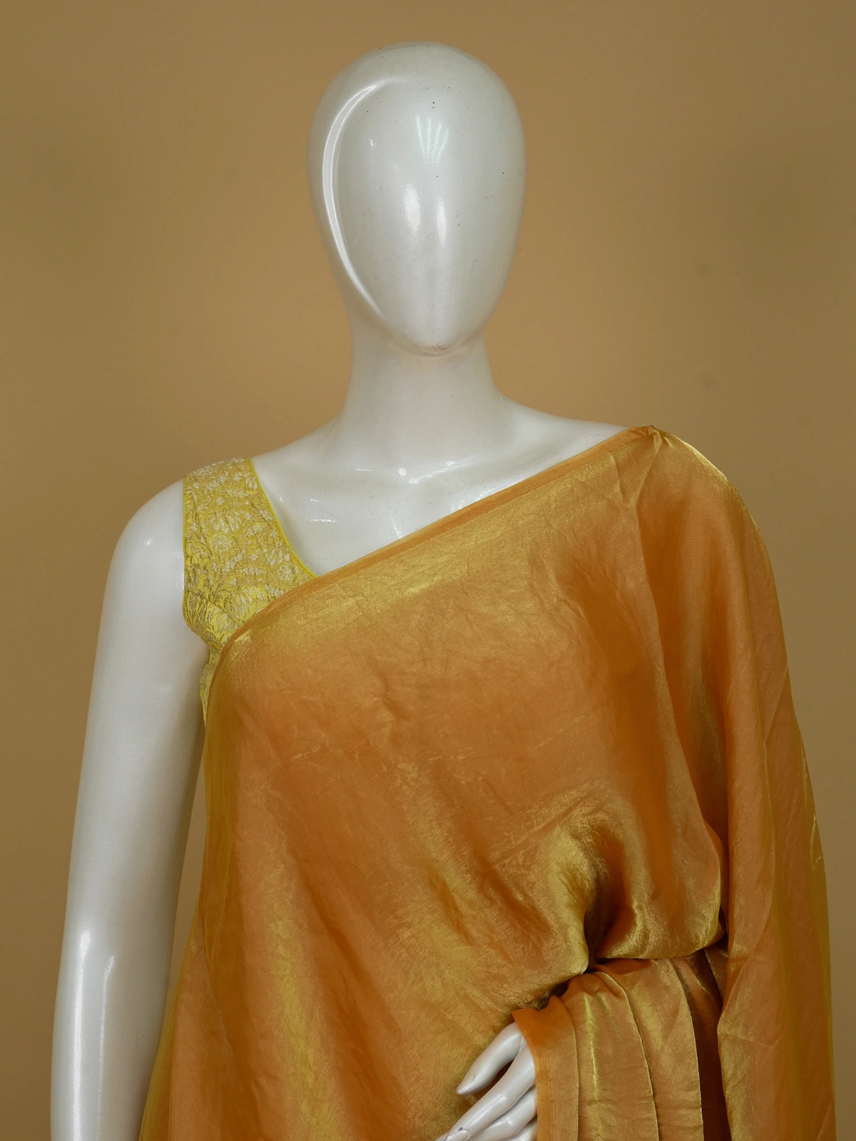 Mustard yellow tissue designer saree with shimmering body and contrast floral printed blouse
