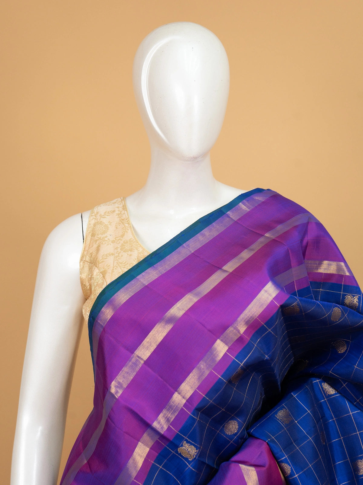 Royal blue pure Kanchipuram silk saree with gold zari checks and a contrast magenta zari border