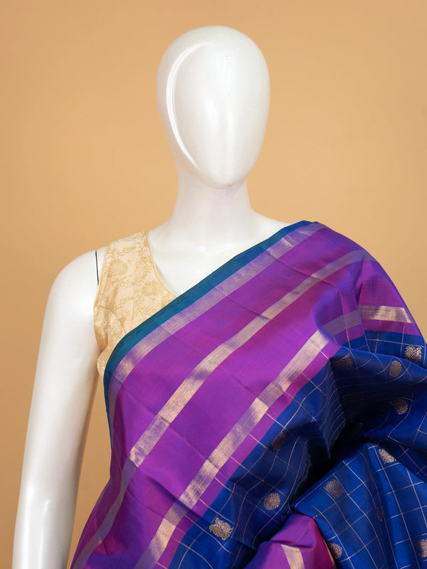 Royal blue pure Kanchipuram silk saree with gold zari checks and a contrast magenta zari border