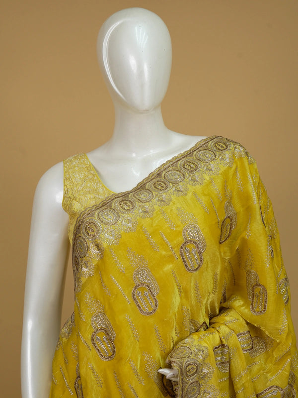 Yellow designer saree with gold zari and stone paisley motifs and embellished border