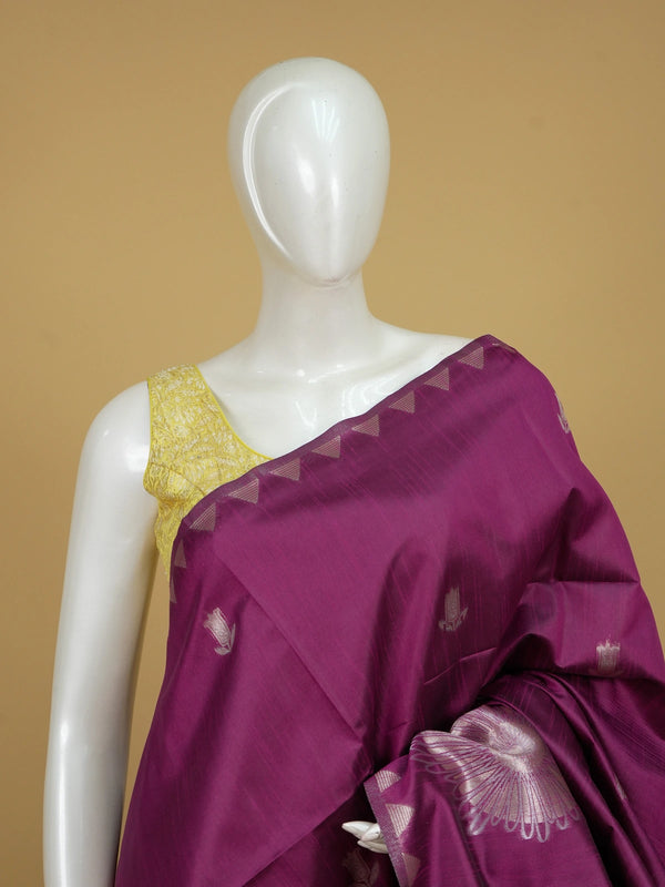 Magenta semi tussar saree with silver floral medallions and temple triangle border