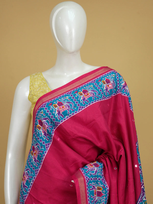 Rani pink linen cotton saree with teal and purple patola elephant border and mirror-work body