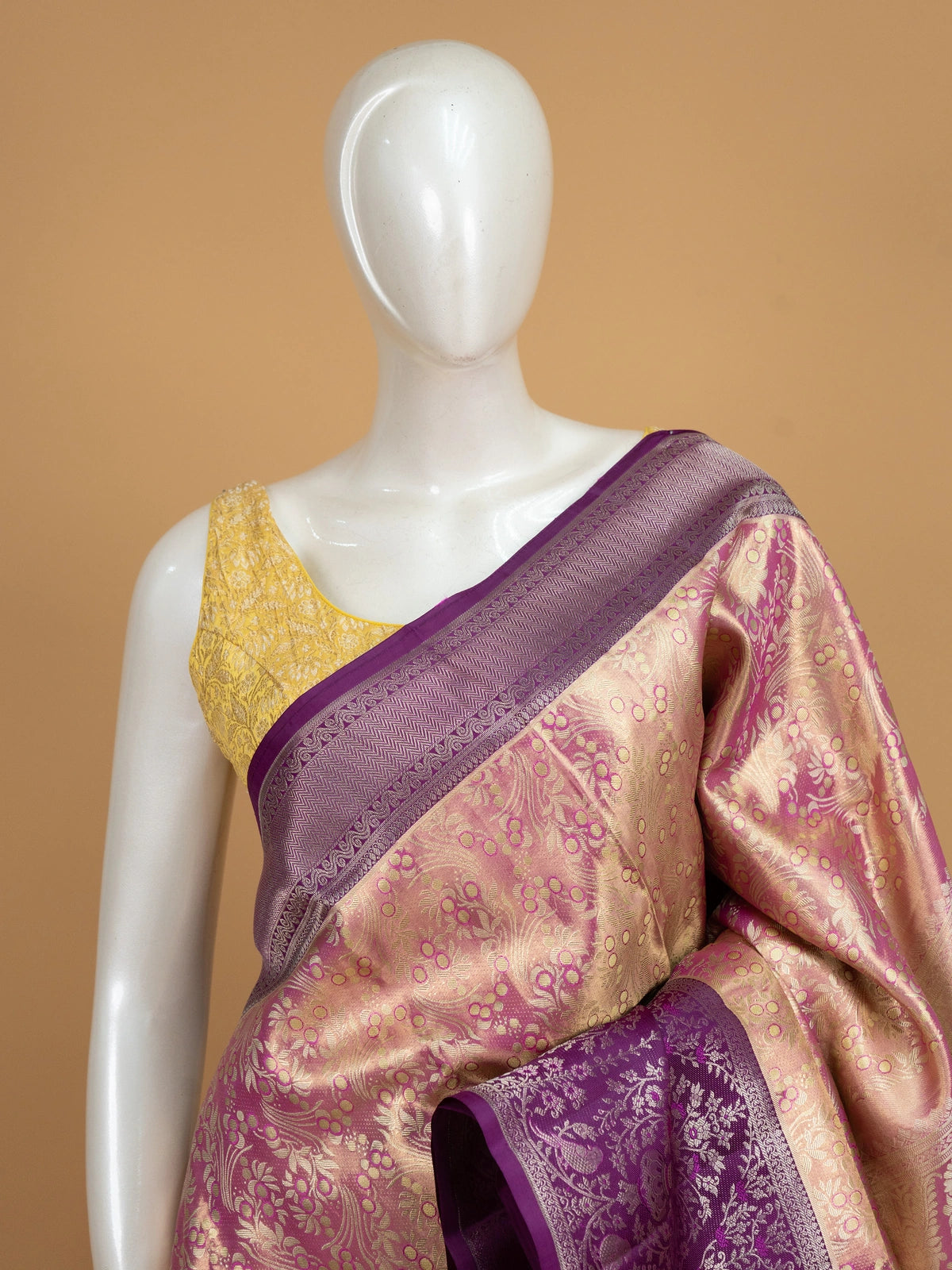 Rose gold and purple pure Kanchipuram silk saree with gold zari floral jaal body and contrast purple peacock border