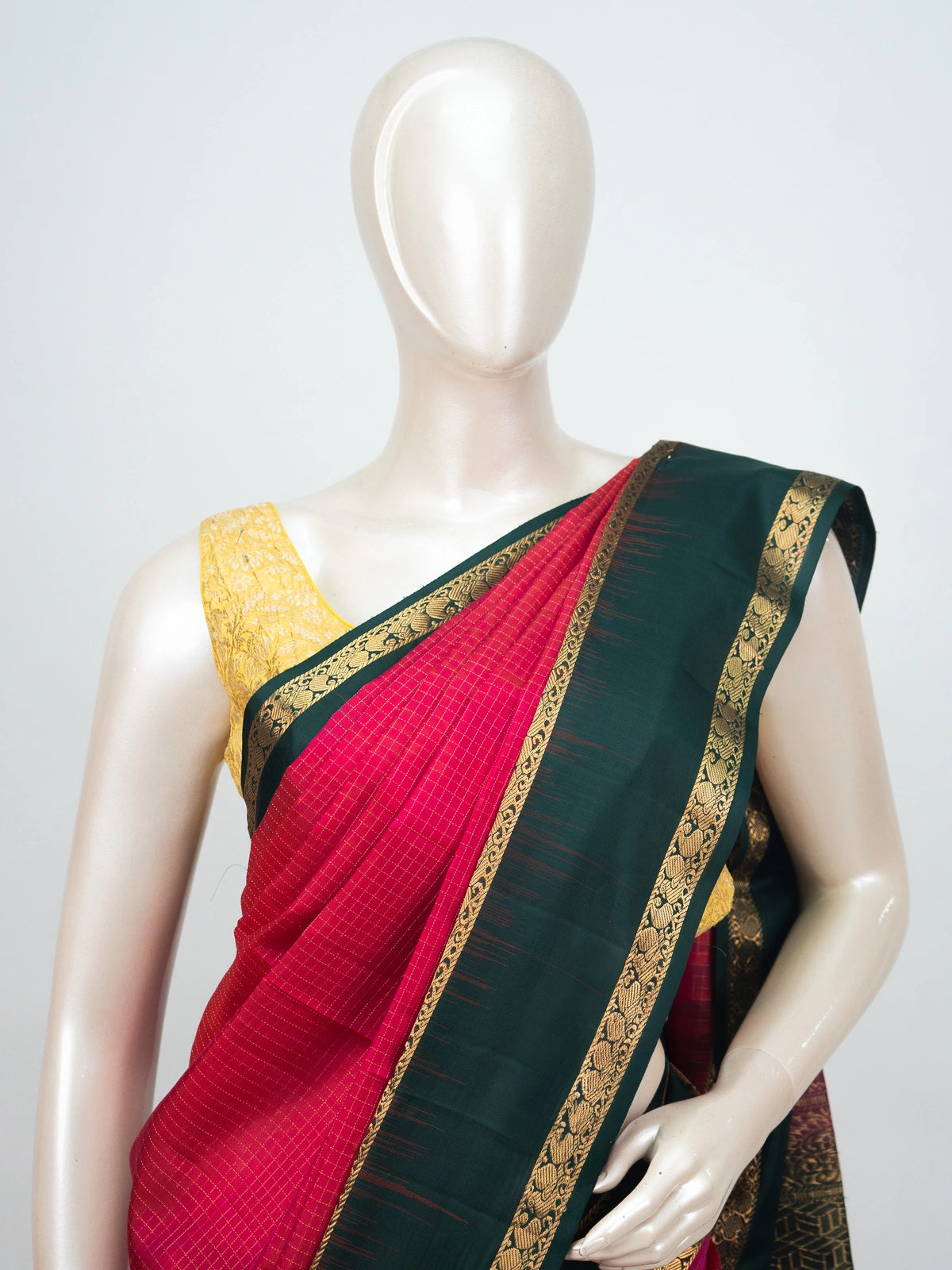 Pink soft silk saree with bottle-green contrast gold zari border and woven zari pallu