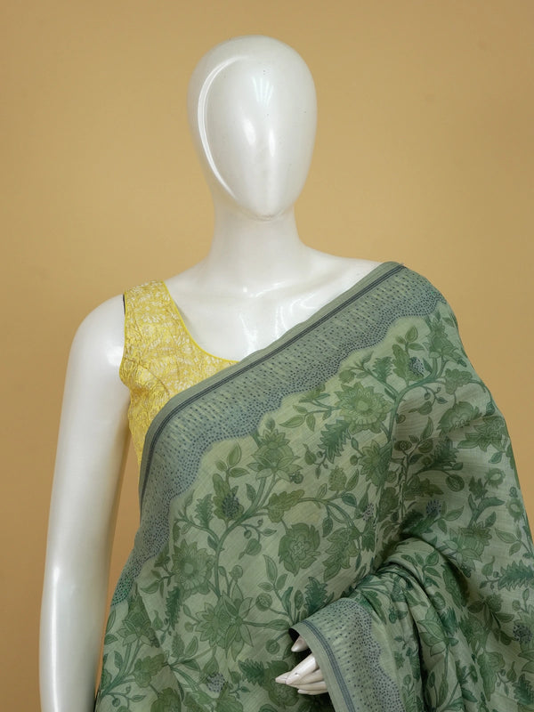 Sage green floral printed linen cotton saree with grey dotted border and tree-motif pallu