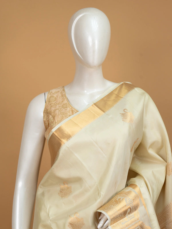 Cream Pure Kanchipuram silk saree with gold zari swan motifs and broad zari border