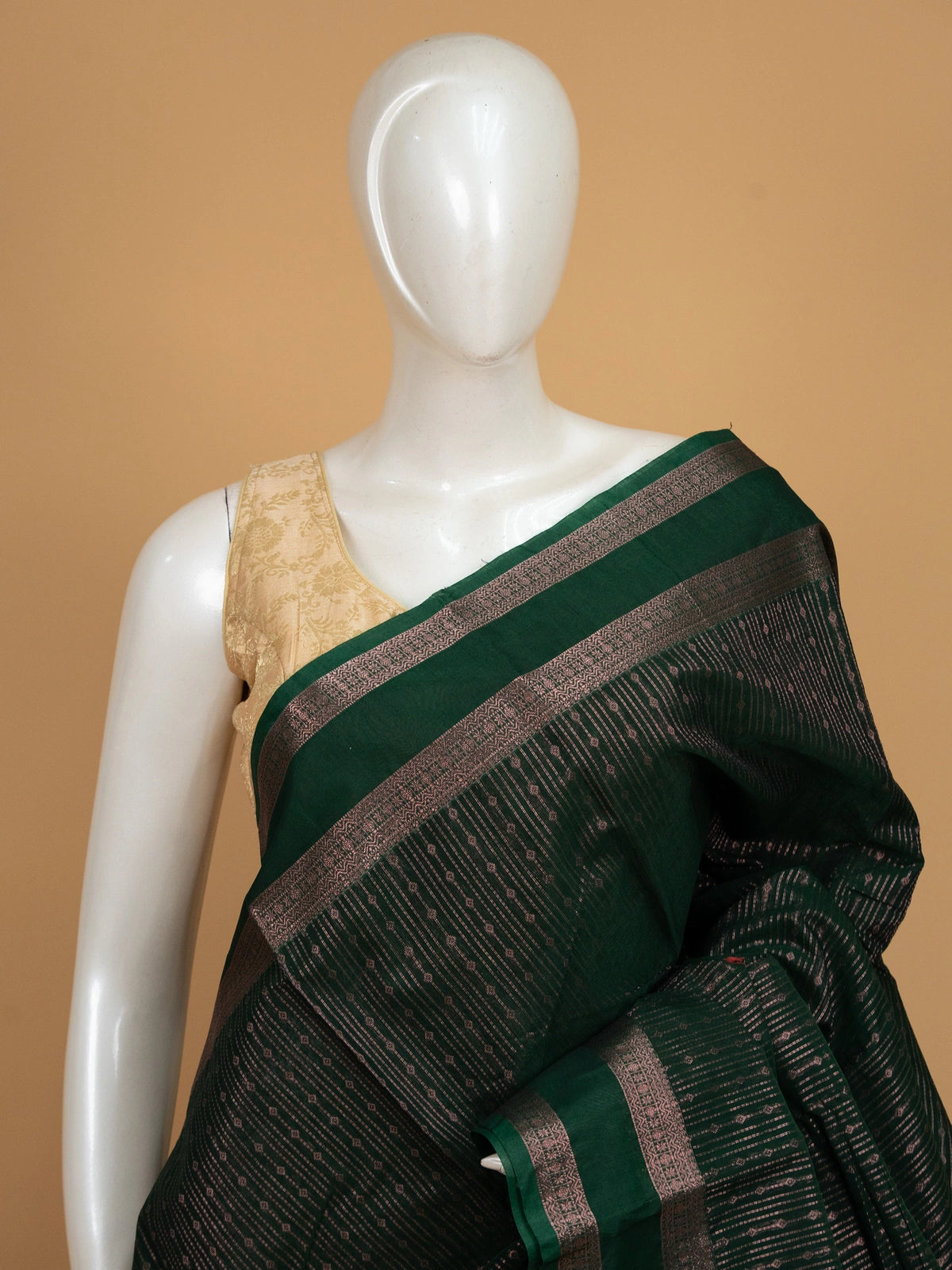 Dark green silk cotton saree with contrast maroon zari border and woven pallu