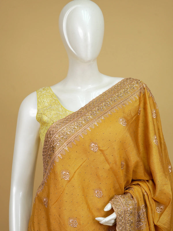 Mustard yellow designer saree with rose-gold embroidered butas, paisley pallu and embellished border