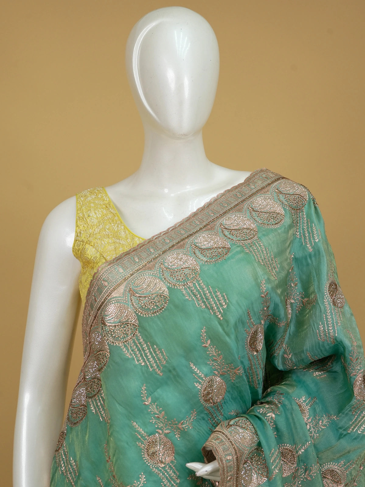 Sea green designer saree with gold zari floral embroidery and embellished scalloped border
